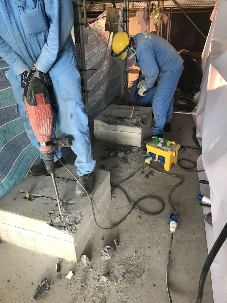 Workers performing civil works and concrete foundation preparation