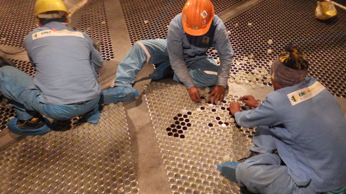 Einz workers performing catalyst changeout services inside a vessel